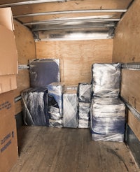 Furniture wrapped with high-quality and perfect stacked in a box truck 